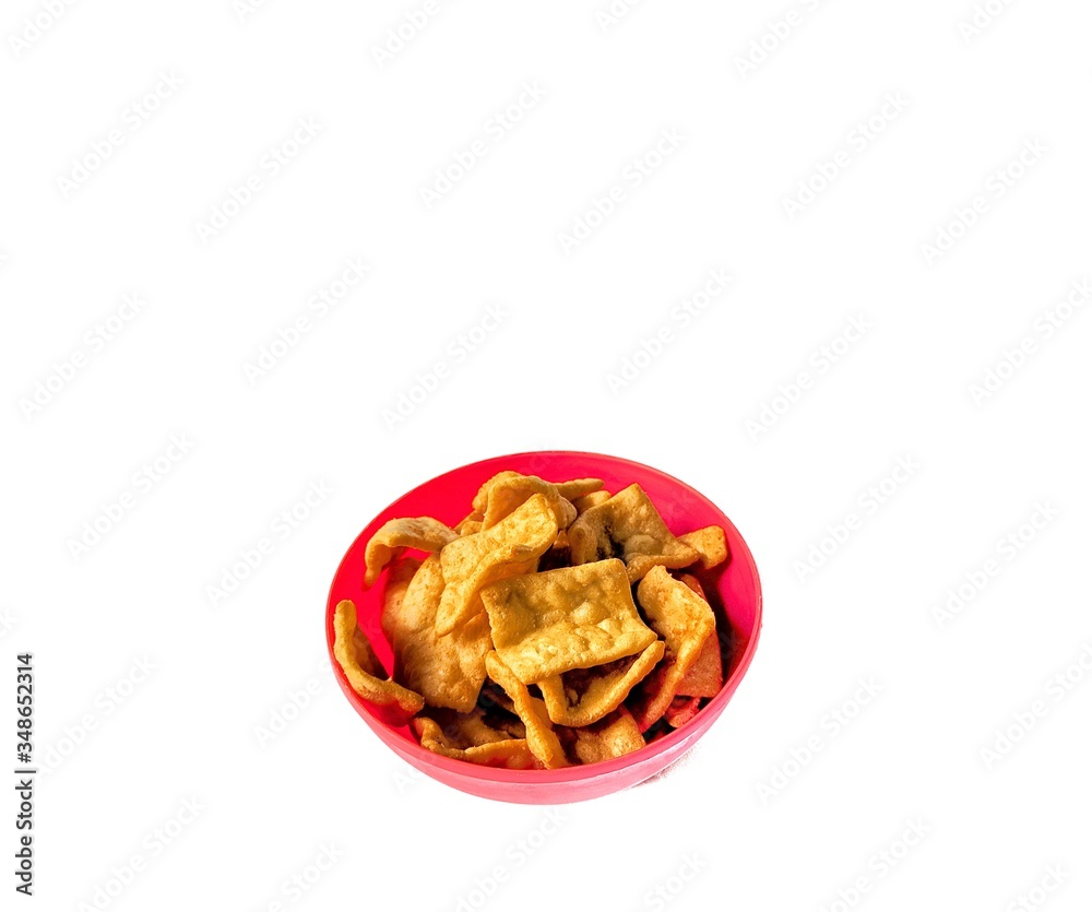 Bowl with pork rind on white background. junk food concept Bowl with pork rind on white background. junk food concept