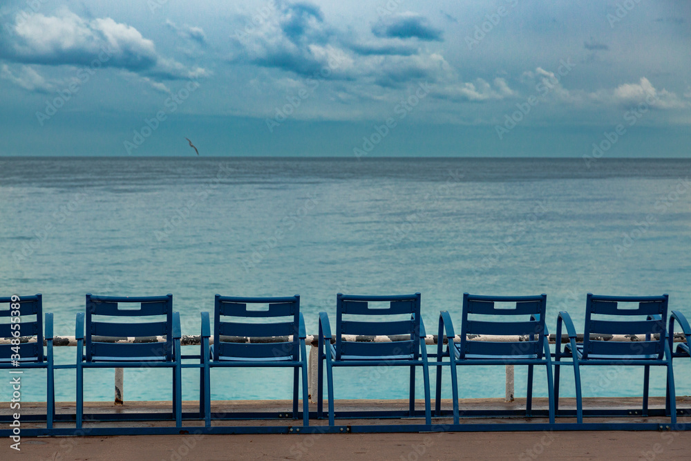 Empty chairs on a coastline of Nice. Isolation time in Europe. Favorite place on Cort de Azur. Empty chairs on a coastline of Nice. Isolation time in Europe. Favorite place on Cort de Azur.
