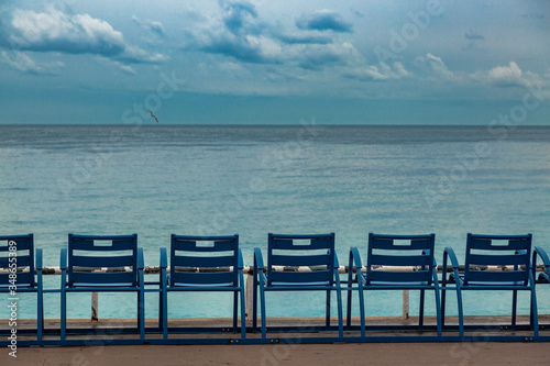 Empty chairs on a coastline of Nice. Isolation time in Europe. Favorite place on Cort de Azur.