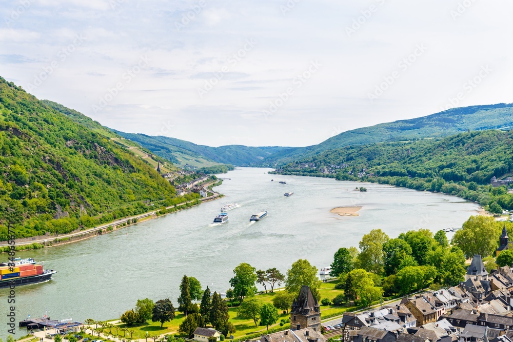 Bacharach am Rhein. Beautiful aerial panoramic Postcard view on Middle Rhine River, (Rhein Fluss, Mittelrhein) with ships. Rhineland-Palatinate (Rheinland-Pfalz), Germany UNESCO