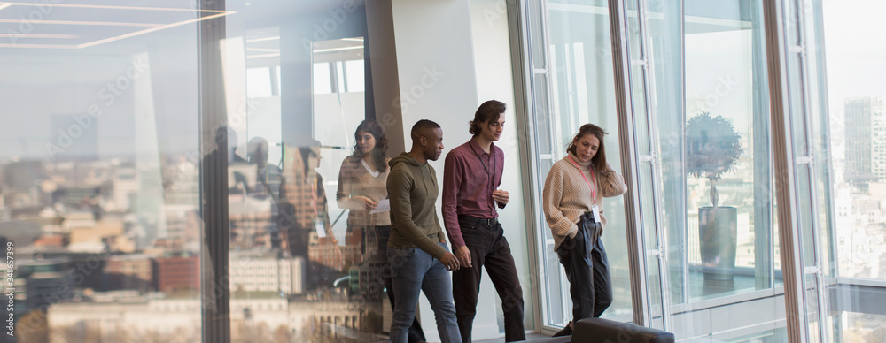 © Tom Merton/Caia Image - Business people walking in urban office