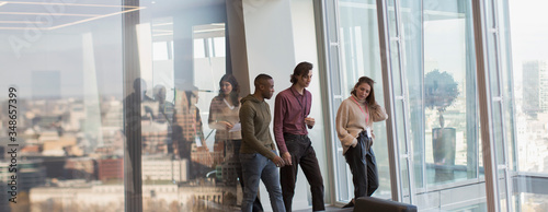 Business people walking in urban office