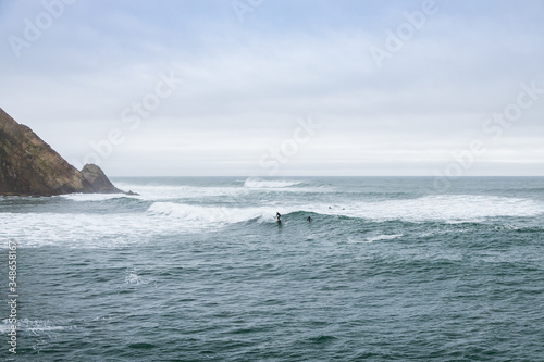 Surfers in the bay
