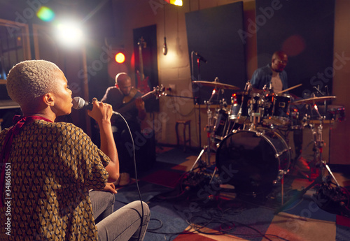 Musicians performing in recording studio