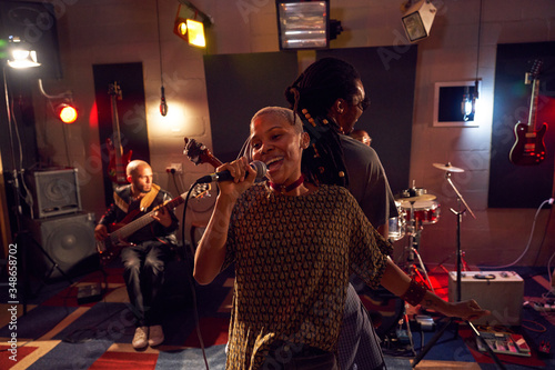 Happy musicians performing on stage