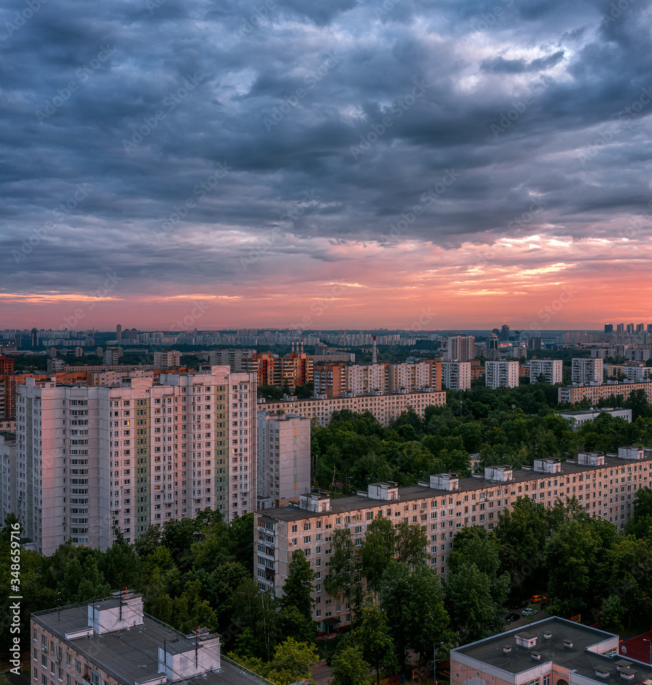 Panel houses. Sunset over the sleeping area of Moscow. Metro Skhodnenskaya. Cloudy weather.