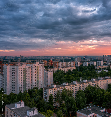 Panel houses. Sunset over the sleeping area of Moscow. Metro Skhodnenskaya. Cloudy weather. © mazurevanasta