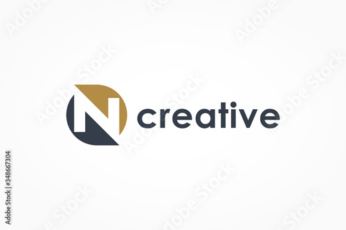 Abstract Initial Letter N Logo. Blue and Gold Circle Shape Combination with Negative Space Letter inside. Usable for Business and Technology Logos. Flat Vector Logo Design Template Element.