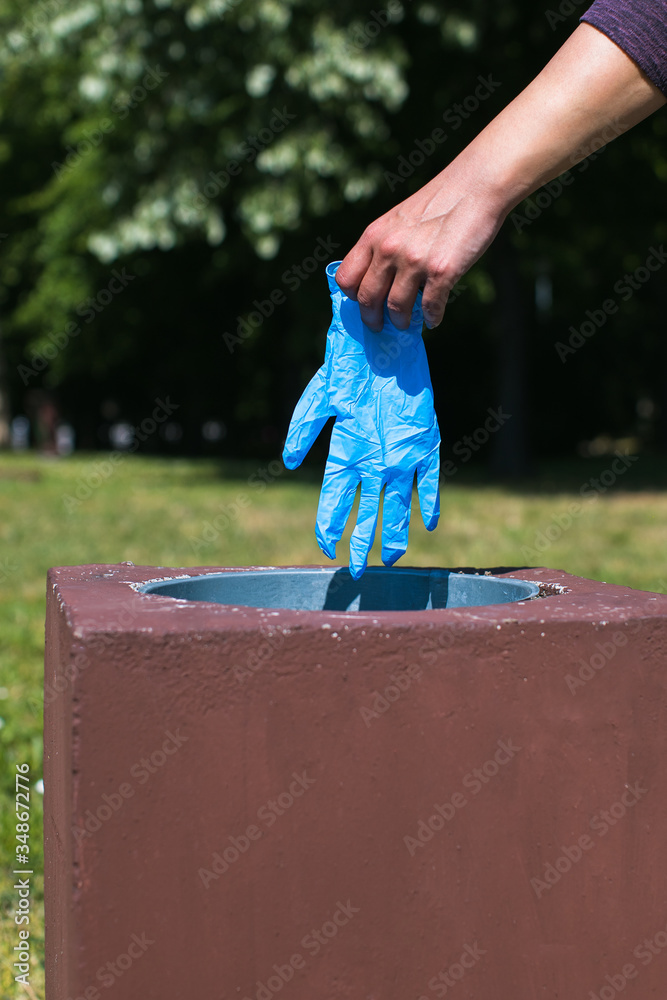 disposing of protective glove in public park bin
