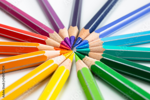Colored pencils isolated on white. Macro still-file picture made in studio with softbox.