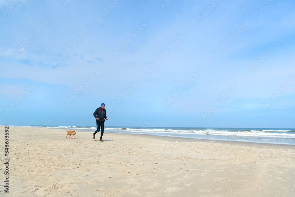 Senior man running at the beach