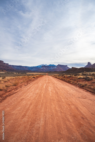 Unpaved road at Arches National Park when Sun is rising