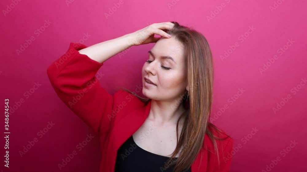 The young girl straightens her beautiful hair. The young girl straightens her beautiful hair.