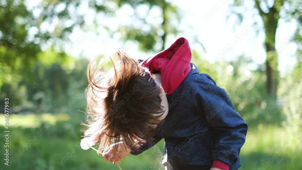 The child sneezes, an exacerbation of seasonal pollen allergy. Slow motion