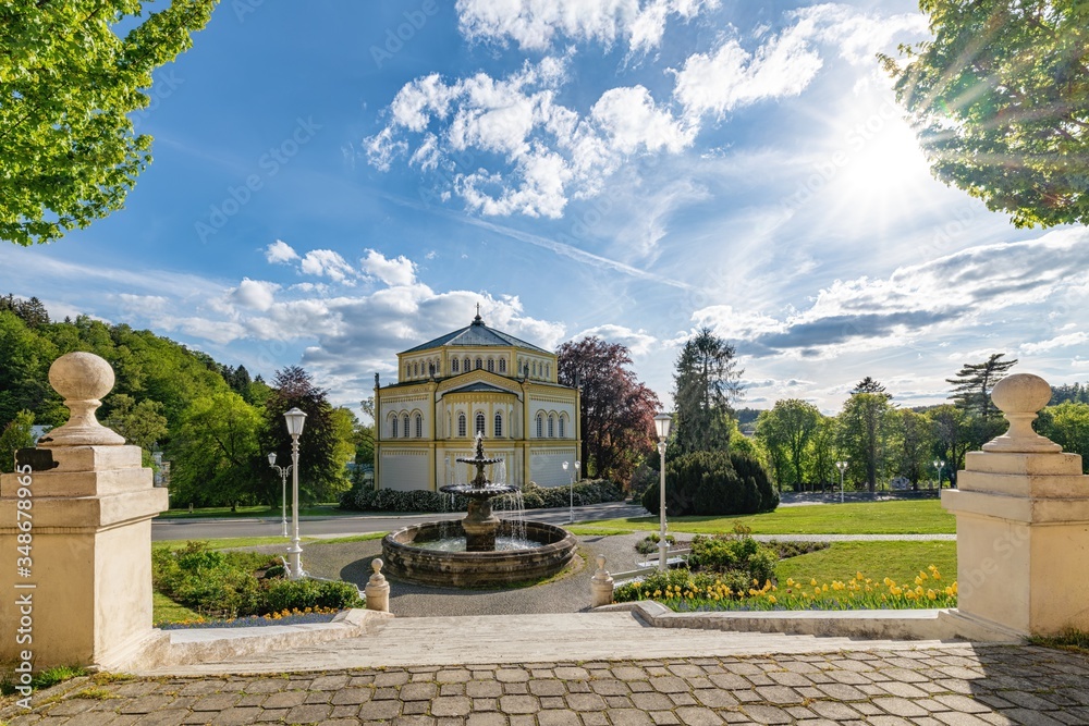 Fototapeta premium Goethe Square - Catholic church in the park of small spa town Marianske Lazne (Marienbad) - Czech Republic