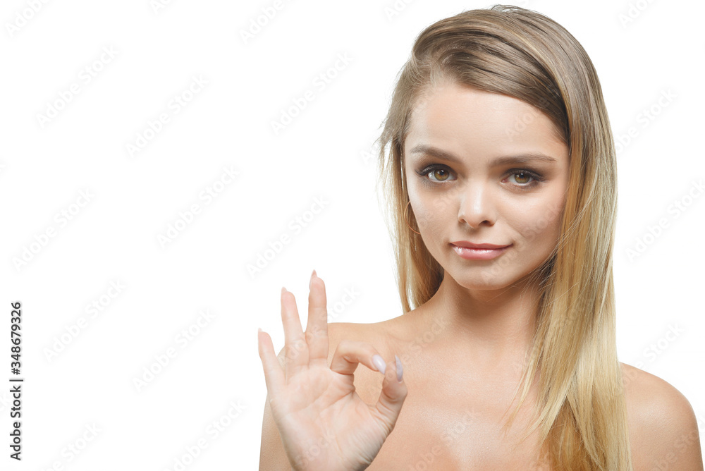The girl shows the gesture everything is fine on a white background. The girl shows the gesture everything is fine on a white background.