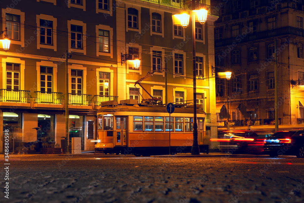 Obraz premium famous yellow tram at illuminated street in Lisbon 