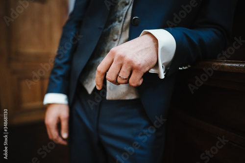photo of a groom's suit with flowers
