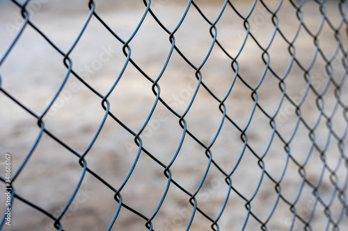 Stretched metal mesh on a blurred background