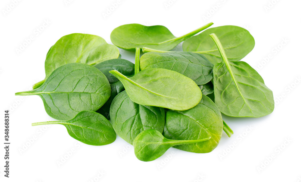 Heap of fresh spinach leafs isolated on white Heap of fresh spinach leafs isolated on white