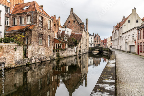 Buildings around channels and bridge in Bruges
