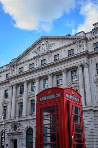 London Telephone box in front of white building