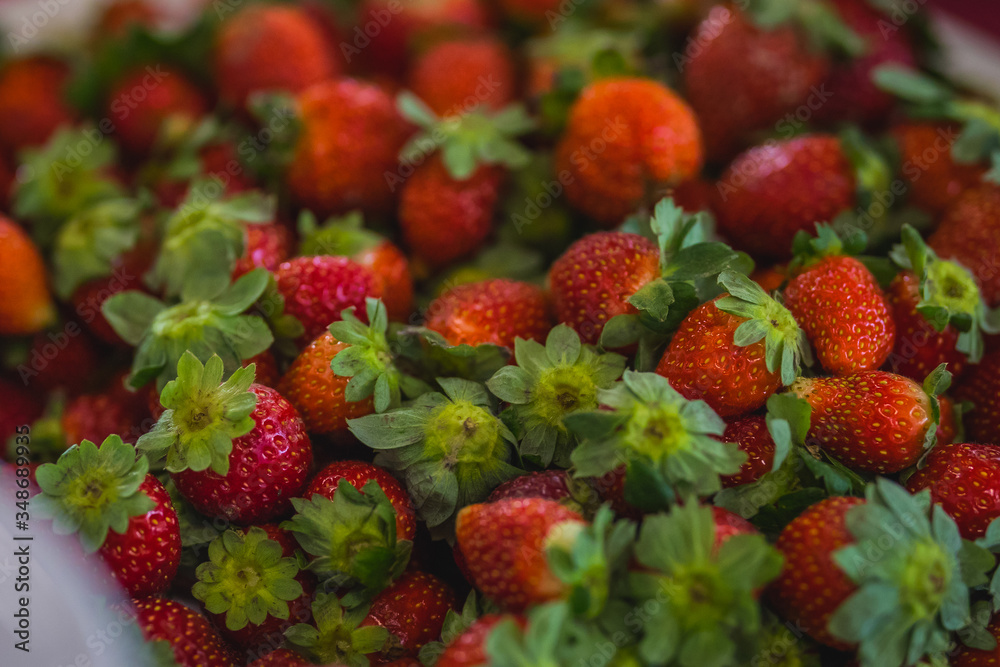Red strawberries in a bowl.
