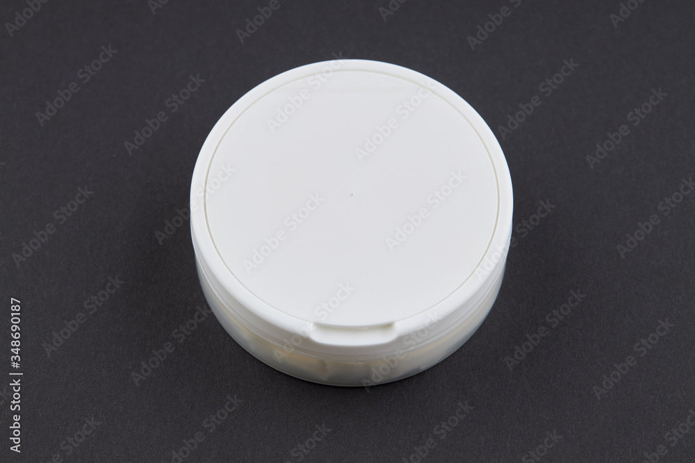 snus tobacco pouch blank box over black background. outer space. alternative chewing nicotine smoking. snus tobacco pouch blank box over black background. outer space. alternative chewing nicotine smoking.