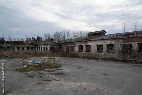 an old abandoned building with debris and broken Windows © евгений ставников