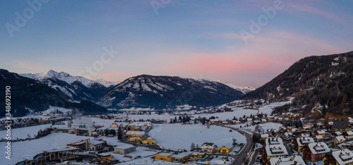 Panoramic view on Sankt Michael im Lungau at sunrise, Austria - January 2020. Aerial drone view.