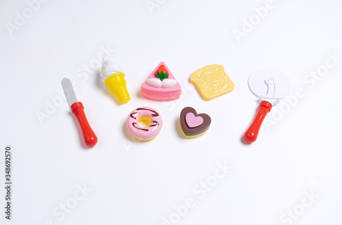 Collection of food toys for kids. Ice cream, slice of cake, donuts. Flay lay image. White background