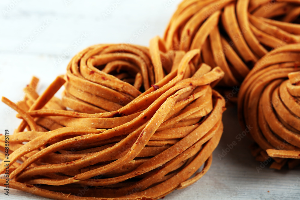 Closeup of raw homemade chili pasta. fresh italian traditional raw fresh pasta