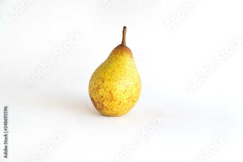 Beautiful ripe yellow pear on white background