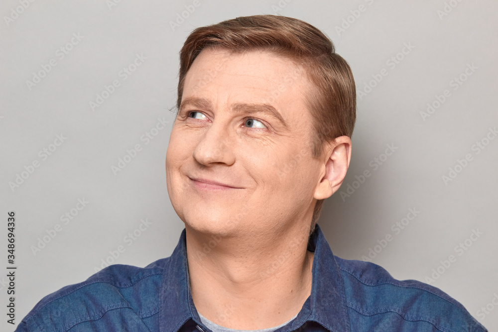 Obraz premium Portrait of blond mature man with happy expression and smiling