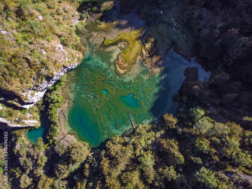 Aerial view of Magdalena Lagoon, in middle of forest, in Sierra de los Cuchumatanes, Huehuetenango, Guatemala