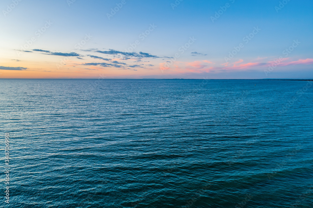 Obraz premium Port Phillip Bay at dusk - aerial landscape with copy space