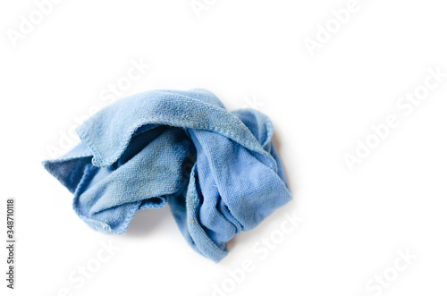 Old dirty torn rag isolated on white background. Cleaning rag.
