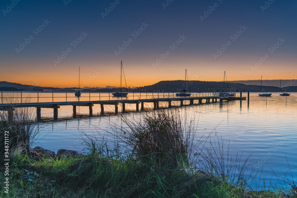 Sunrise, boats and a clear sky over the Bay