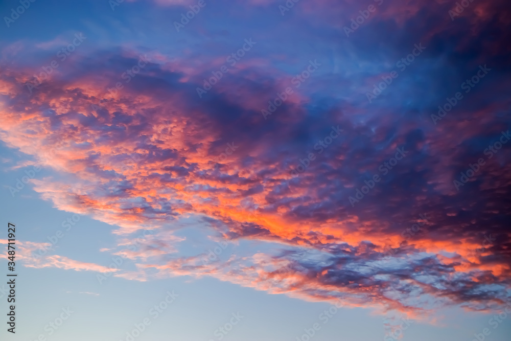 Beautiful sunset on the sky. Purple clouds in the sun. Blurred background for design. Selective focus. Beautiful sunset on the sky. Purple clouds in the sun. Blurred background for design. Selective focus.