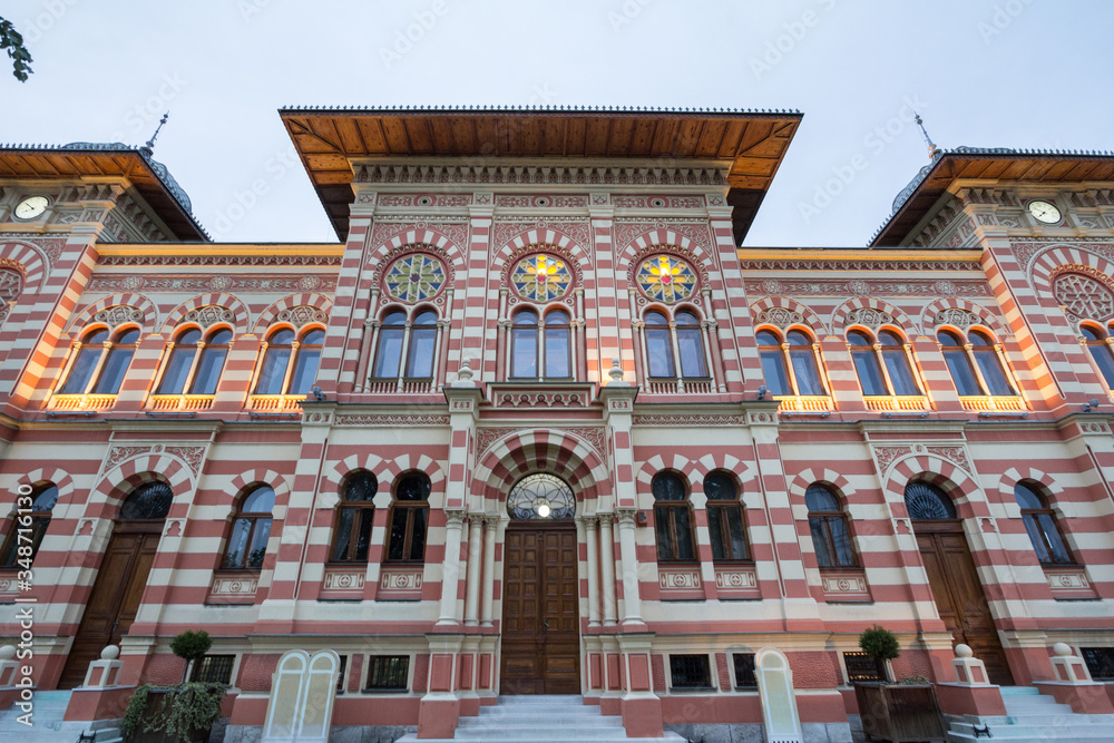 Fototapeta premium Facade and entrance of the main hall of the Vijecnica, the former library and city hall of Brcko, bosnia and Herzegovina, built in the 19th century, characterized by its ottoman style.