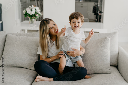 Young mom and toddler learning to count photo