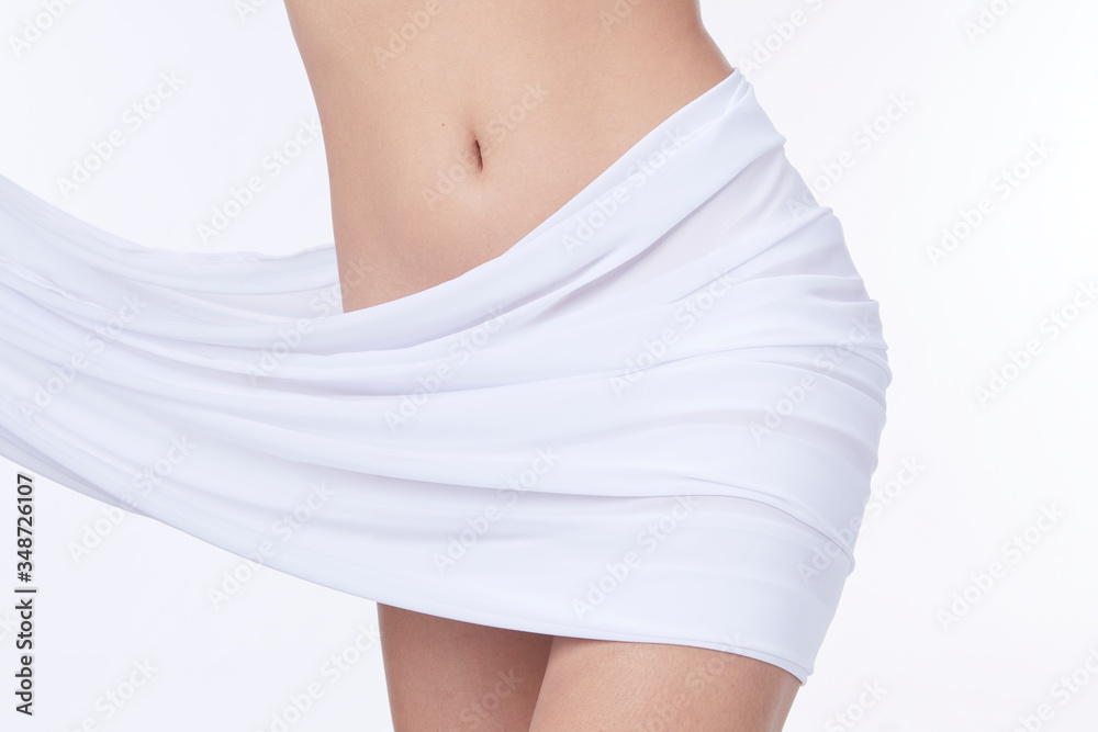Slim tanned woman Perfect Body . Slim toned young body of the girl . An example for sports and fitness or plastic surgery and aesthetic cosmetology. Slim tanned woman Perfect Body . Slim toned young body of the girl . An example for sports and fitness or plastic surgery and aesthetic cosmetology.