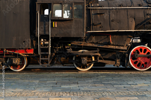 Old steam engine train and parts close-up