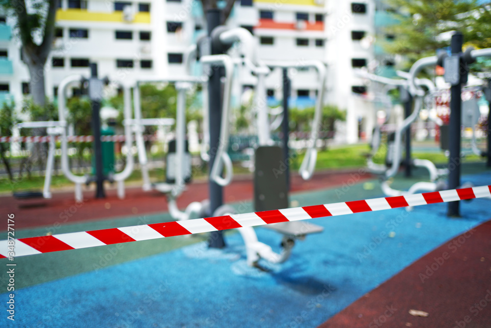 Fototapeta premium Editorial submission - COVID19 tape barriers surrounding exercise areas in Singapore