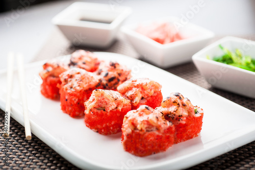 Hot sushi koumi maki on a dish photo