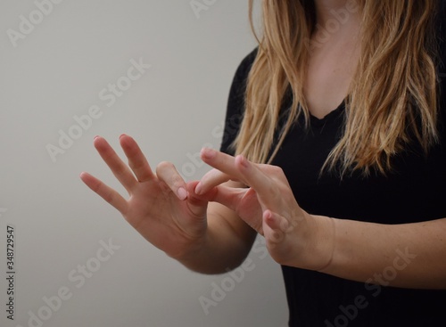 Woman interpreting American Sign Language