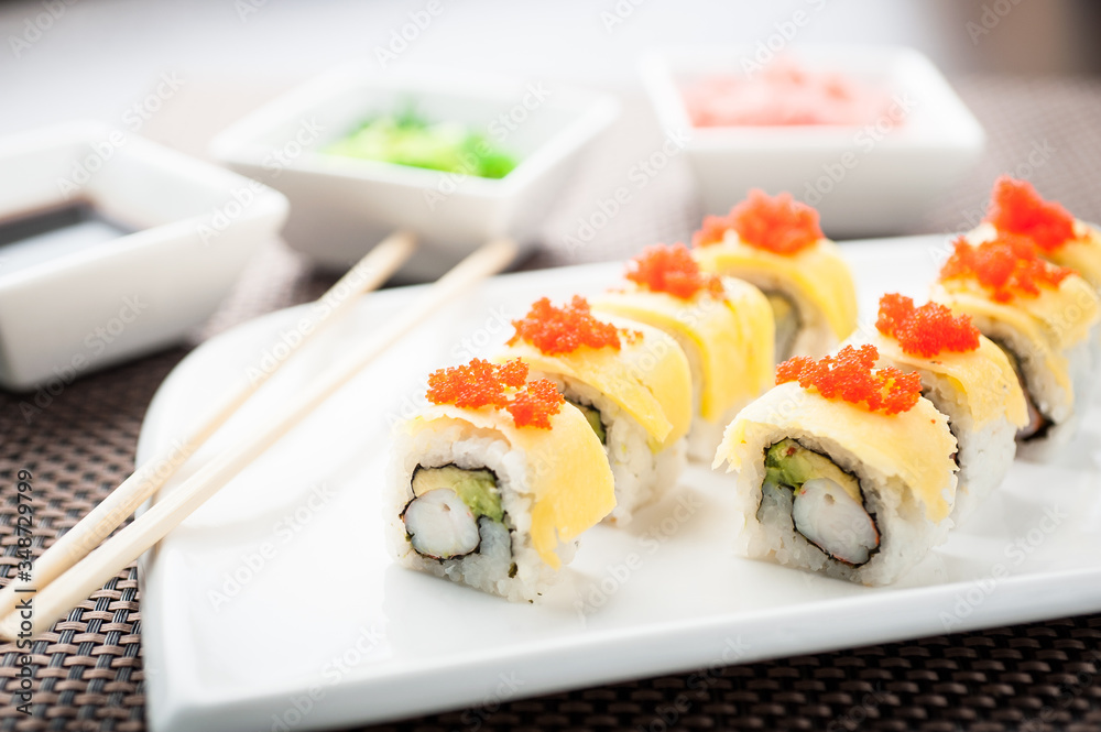 Uramaki sushi mango classic maki on a dish Uramaki sushi mango classic maki on a dish