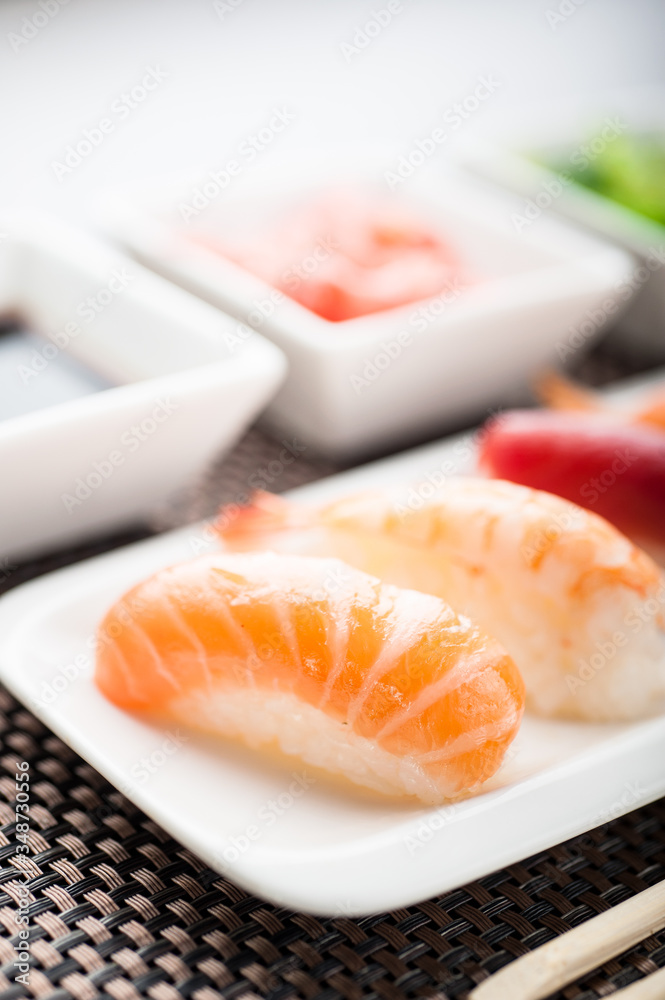 Unagi sushi in front of a nigiri plate Unagi sushi in front of a nigiri plate