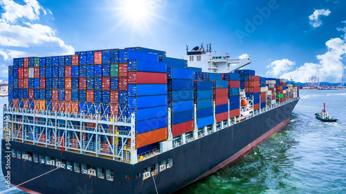 Container cargo ship, Freight shipping maritime vessel, Global business import export commerce trade logistic and transportation oversea worldwide by container cargo ship boat in the open sea.