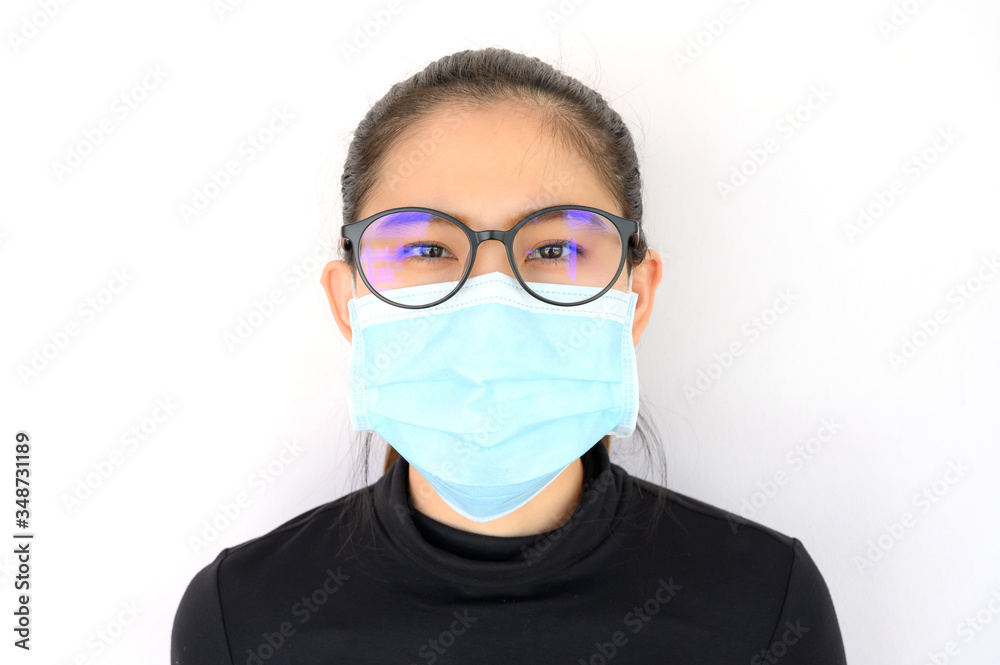 Shot of young Asian woman worring and wearing mask for protect bad air pollution or virus. Air pollution has been associated with diseases of the heart and lungs, cancers and other health problems. Shot of young Asian woman worring and wearing mask for protect bad air pollution or virus. Air pollution has been associated with diseases of the heart and lungs, cancers and other health problems.